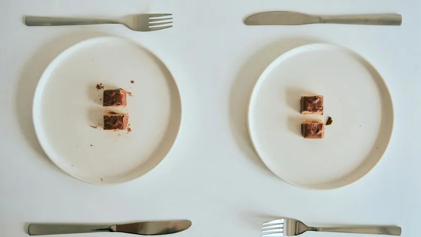 Two identical place settings side by side, seen from above.