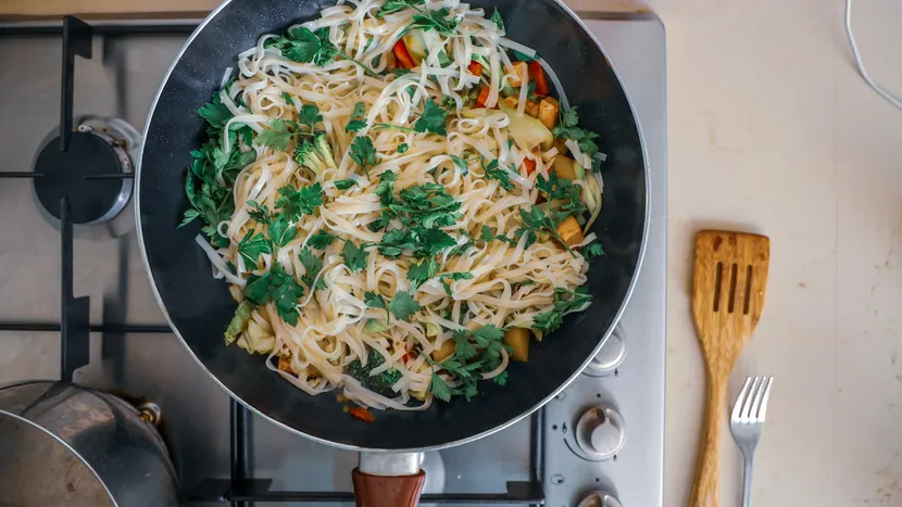 A pan of noodles with vegetables and herbs, cooked in minutes.